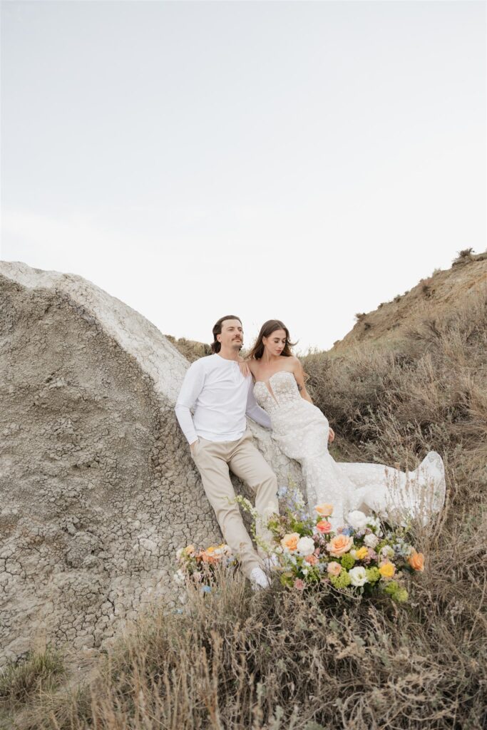 Couple posing for their colorful and fun wedding photos - Saskatchewan wedding