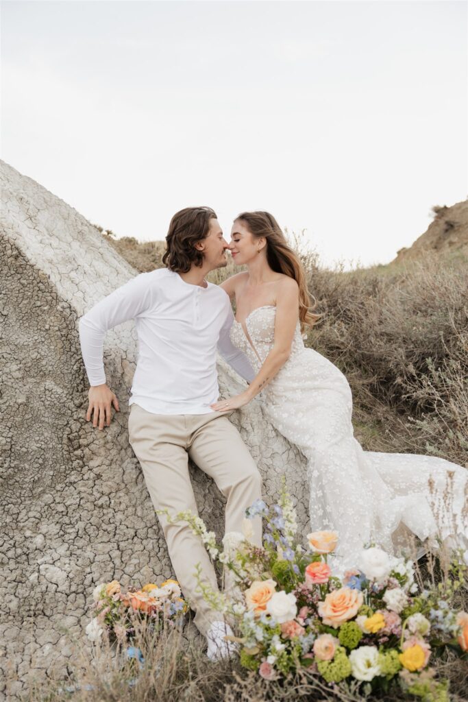 Couple posing for their colorful and fun wedding photos - Saskatchewan wedding 
