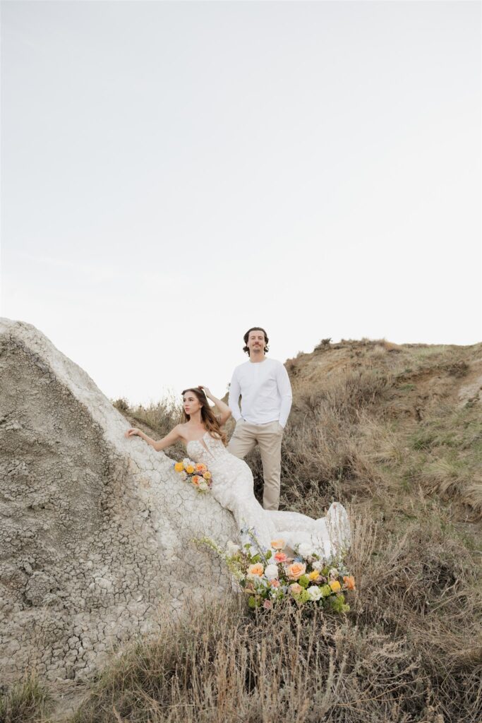 a couple in saskatchewan getting wedding portraits taking with colorful bouquets