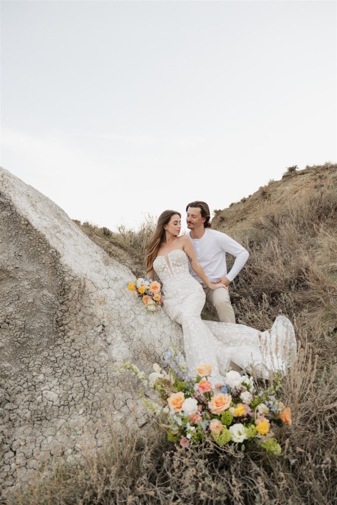 Couple posing for their colorful and fun wedding photos - Saskatchewan wedding 
