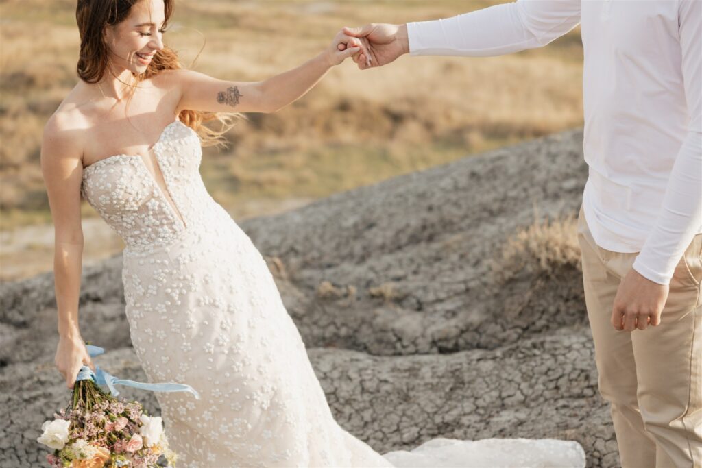 Couple posing for their colorful and fun wedding photos - Saskatchewan wedding 
