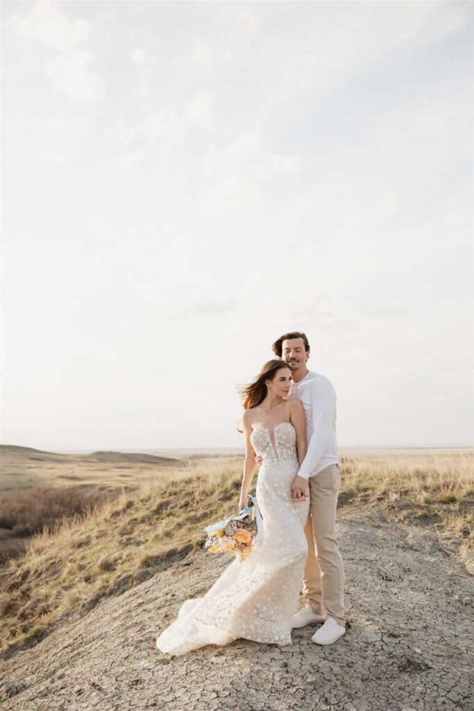 Couple posing for their colorful and fun wedding photos - Saskatchewan wedding 
