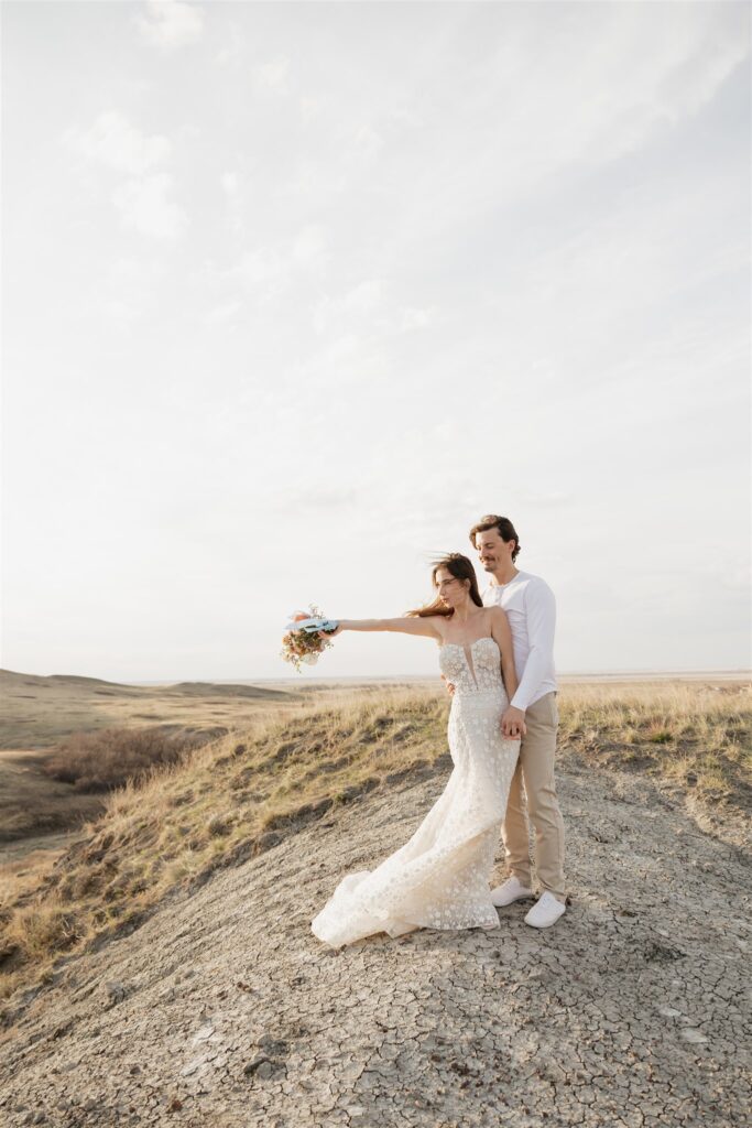 Couple posing for their colorful and fun wedding photos - Saskatchewan wedding 
