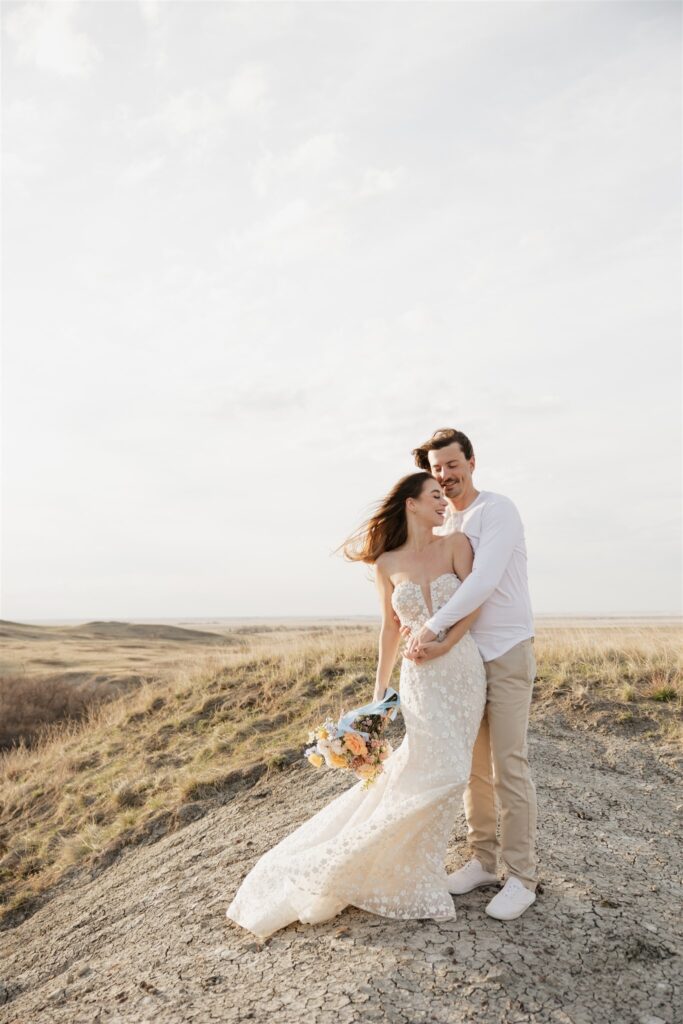 Couple posing for their colorful and fun wedding photos - Saskatchewan wedding 
