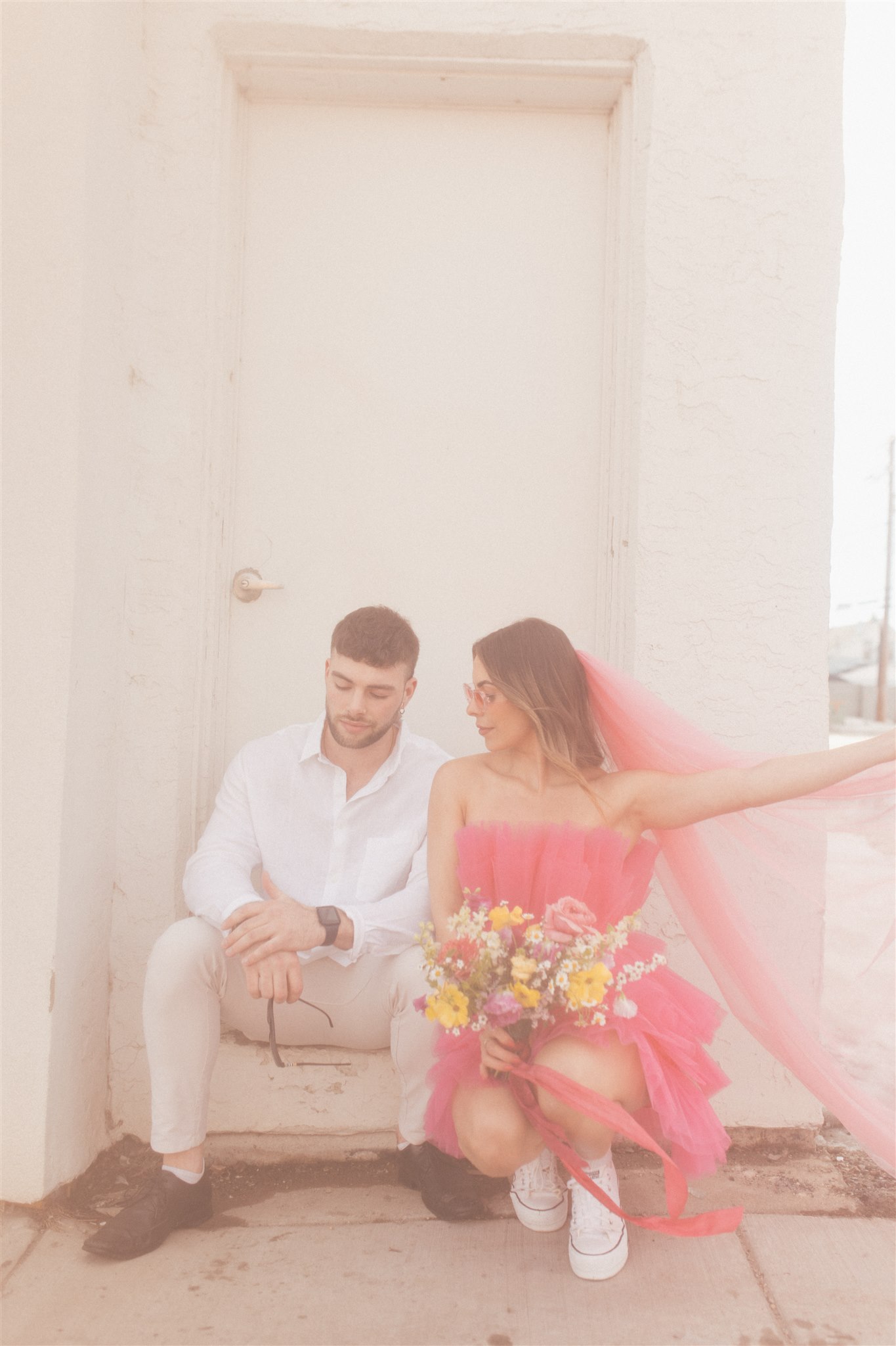 bright and playful photoshoot with couples posing downtown - saskatoon photos