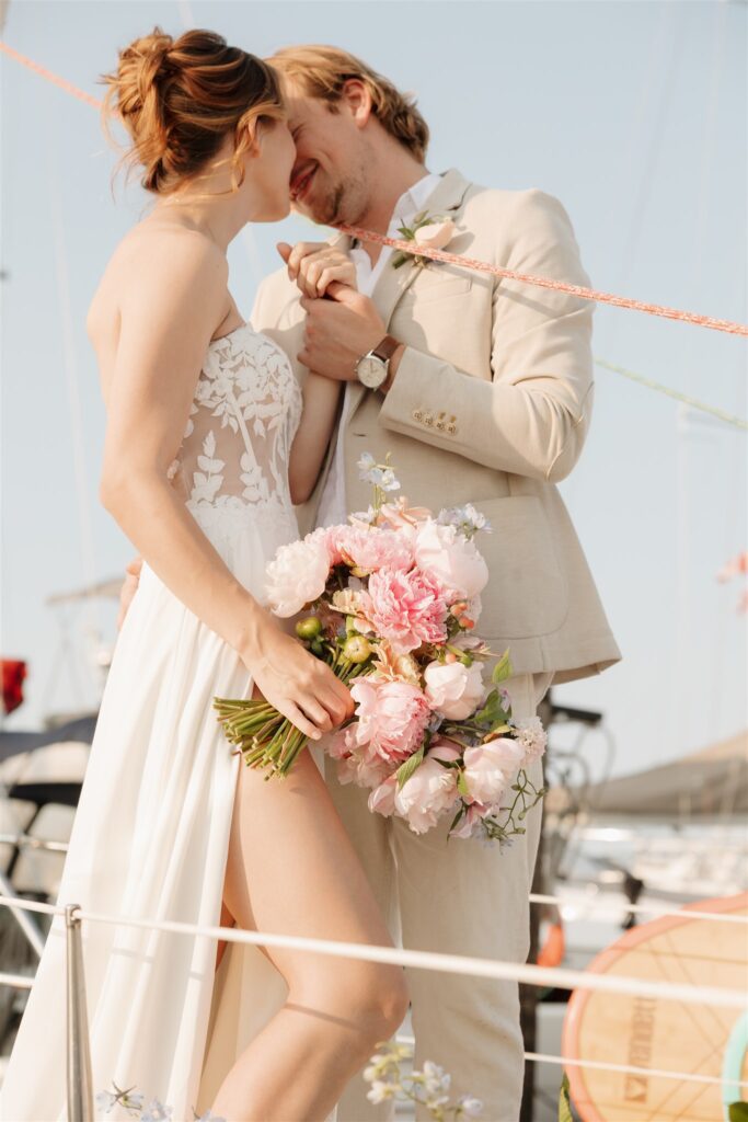 a couple posing in victoria on a boat for their elopement photos
