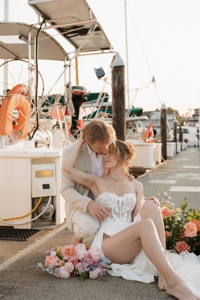 a couple posing in victoria on a boat for their elopement photos
