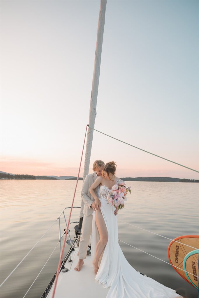 an elopement photoshoot on a sailboat in british columbia