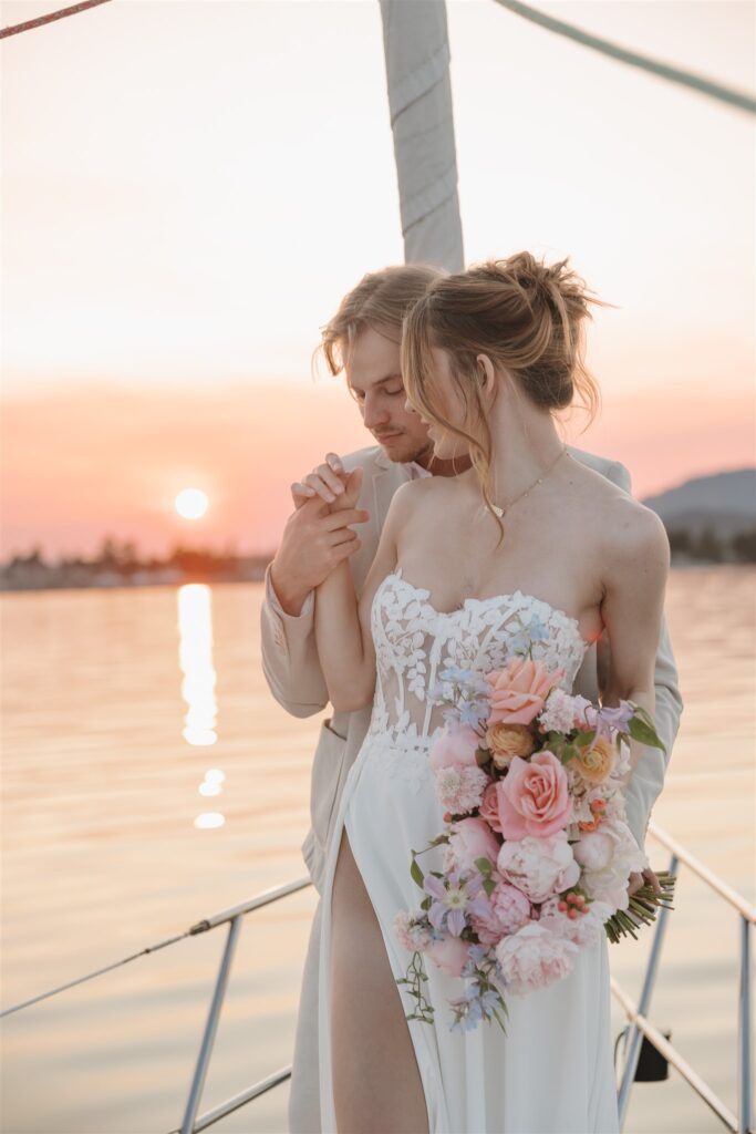 an elopement photoshoot on a sailboat in british columbia