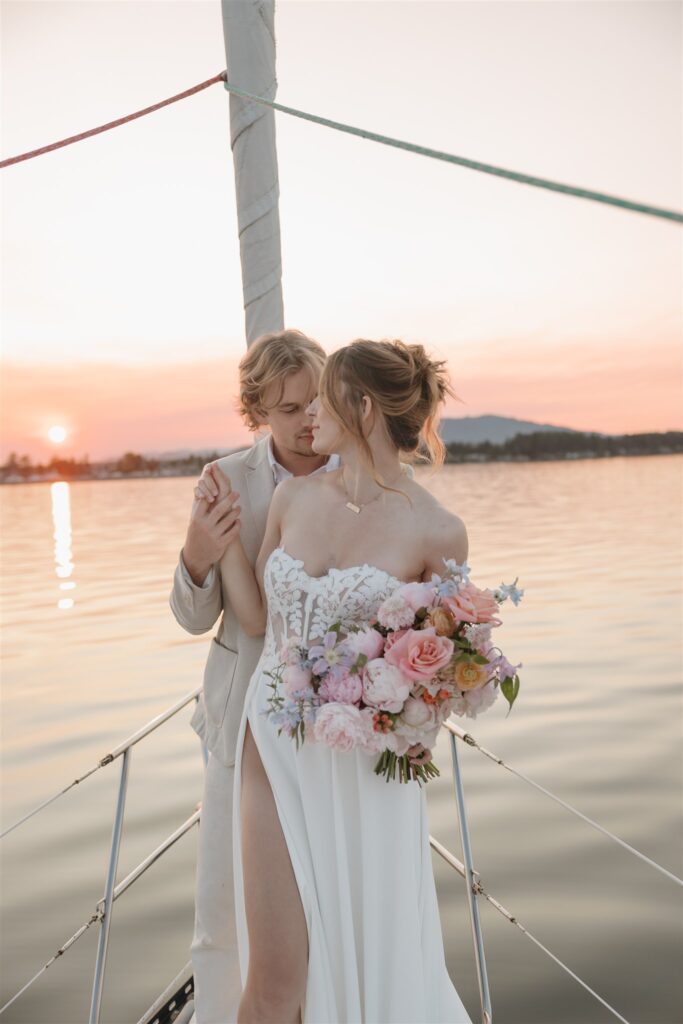 an elopement photoshoot on a sailboat in british columbia