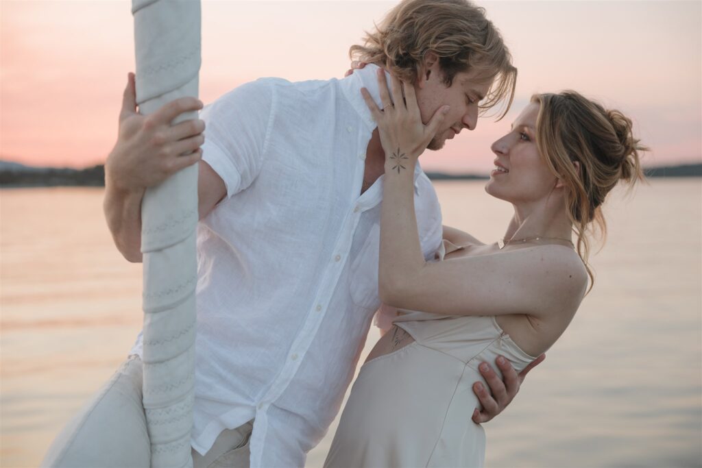 a couple posing in victoria on a boat for their elopement photos
