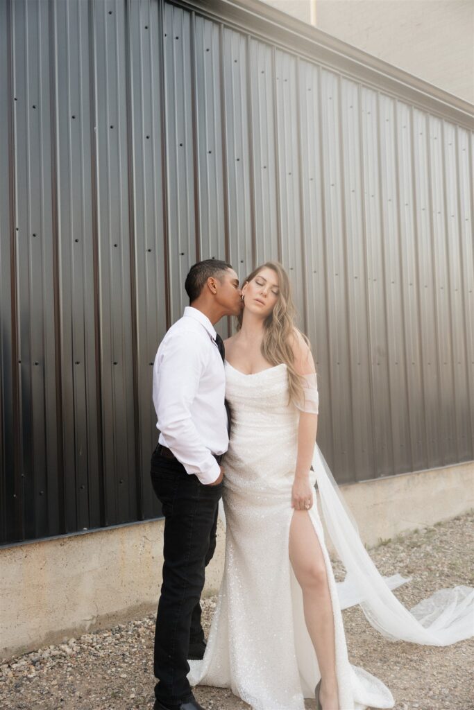 couple posing in downtown Saskatoon for their wedding photos
