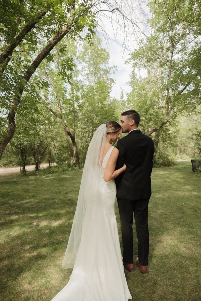 Couple posing for their wedding photos in saskatoon - saskatoon wedding
