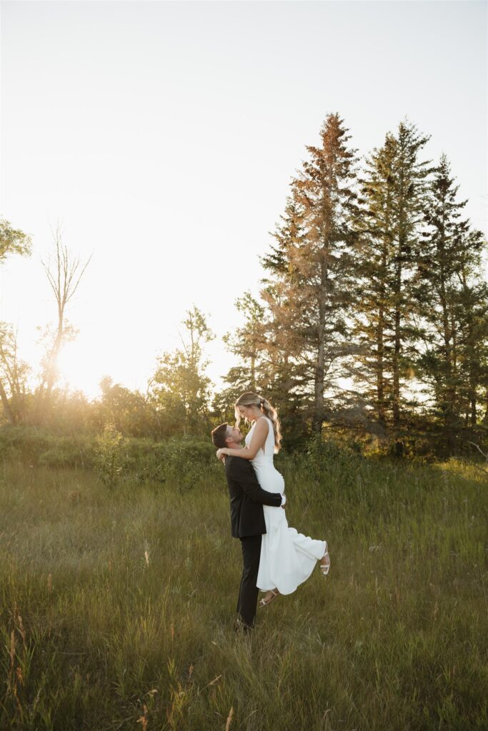 Couple posing for their wedding photos in saskatoon - saskatoon wedding
