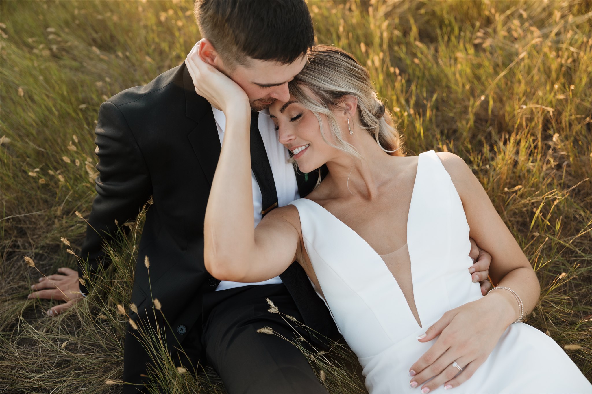 Couple posing for their wedding photos in saskatoon - saskatoon wedding