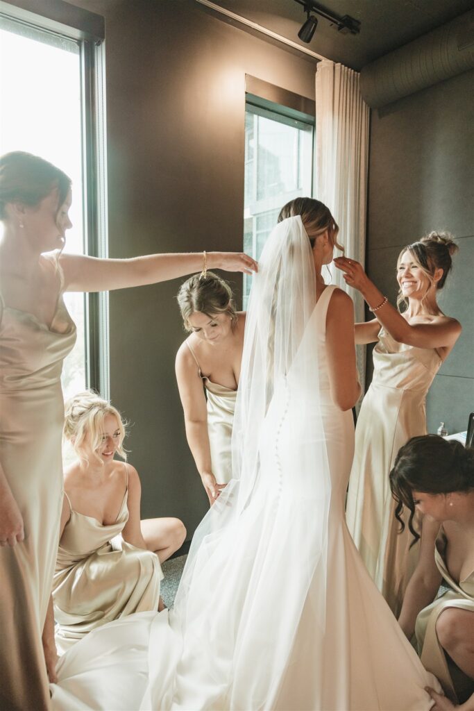 bride posing wit her bridesmaids