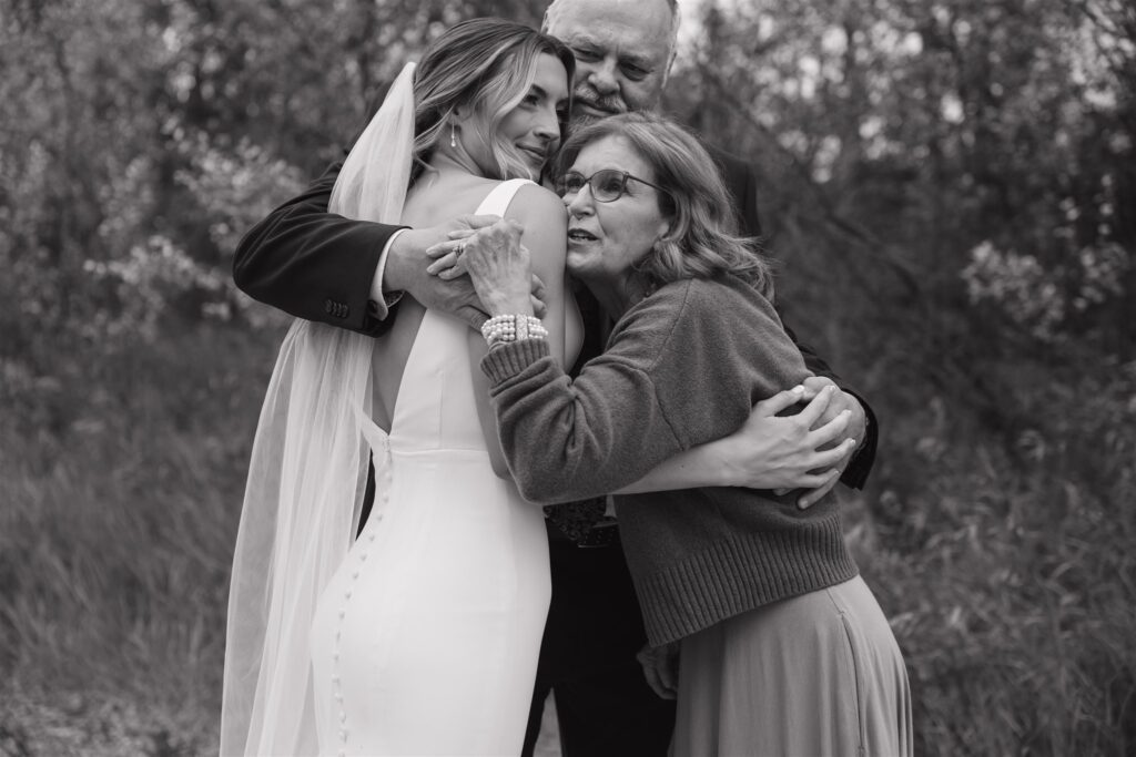 bride doing a first look with her family