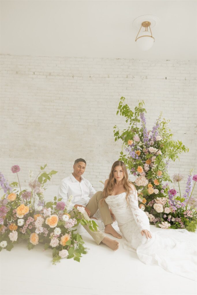 newlyweds posing at a studio in Saskatoon for their wedding portraits | ninth avenue studios