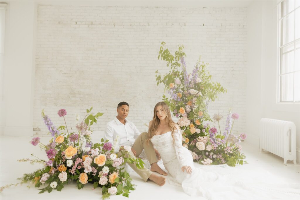 newlyweds posing at a studio in Saskatoon for their wedding portraits | ninth avenue studios