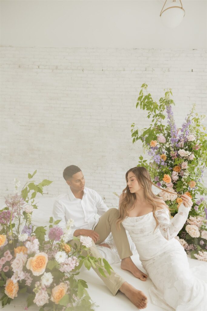 newlyweds posing at a studio in Saskatoon for their wedding portraits | ninth avenue studios