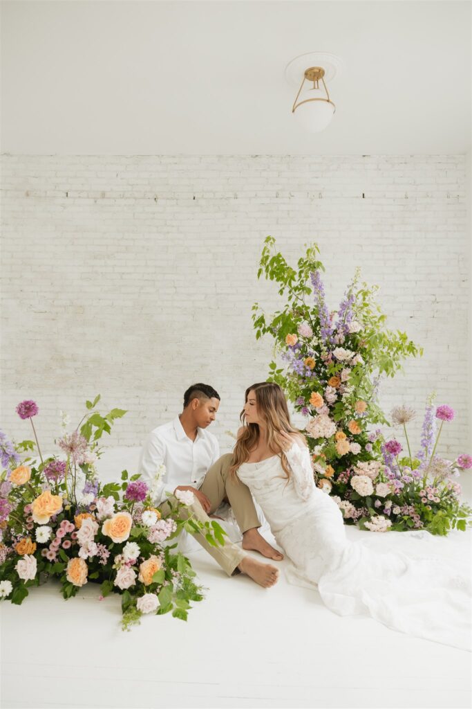 couple posing in a studio for their wedding portraits in canada - editorial wedding
