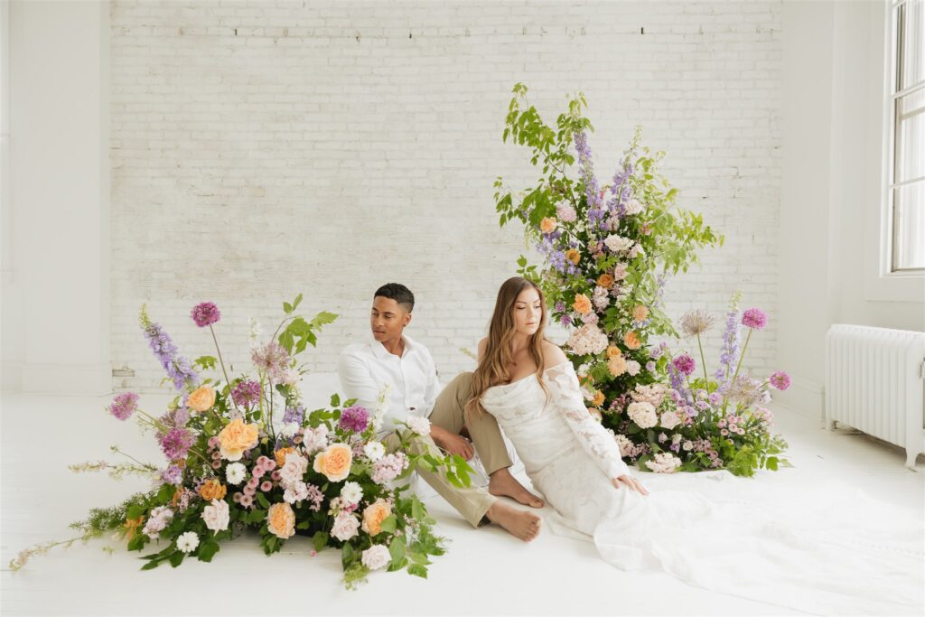 couple posing in a studio for their wedding portraits in canada - editorial wedding
