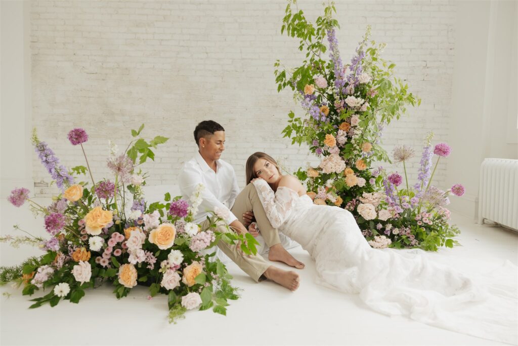 couple posing in a studio for their wedding portraits in canada - editorial wedding
