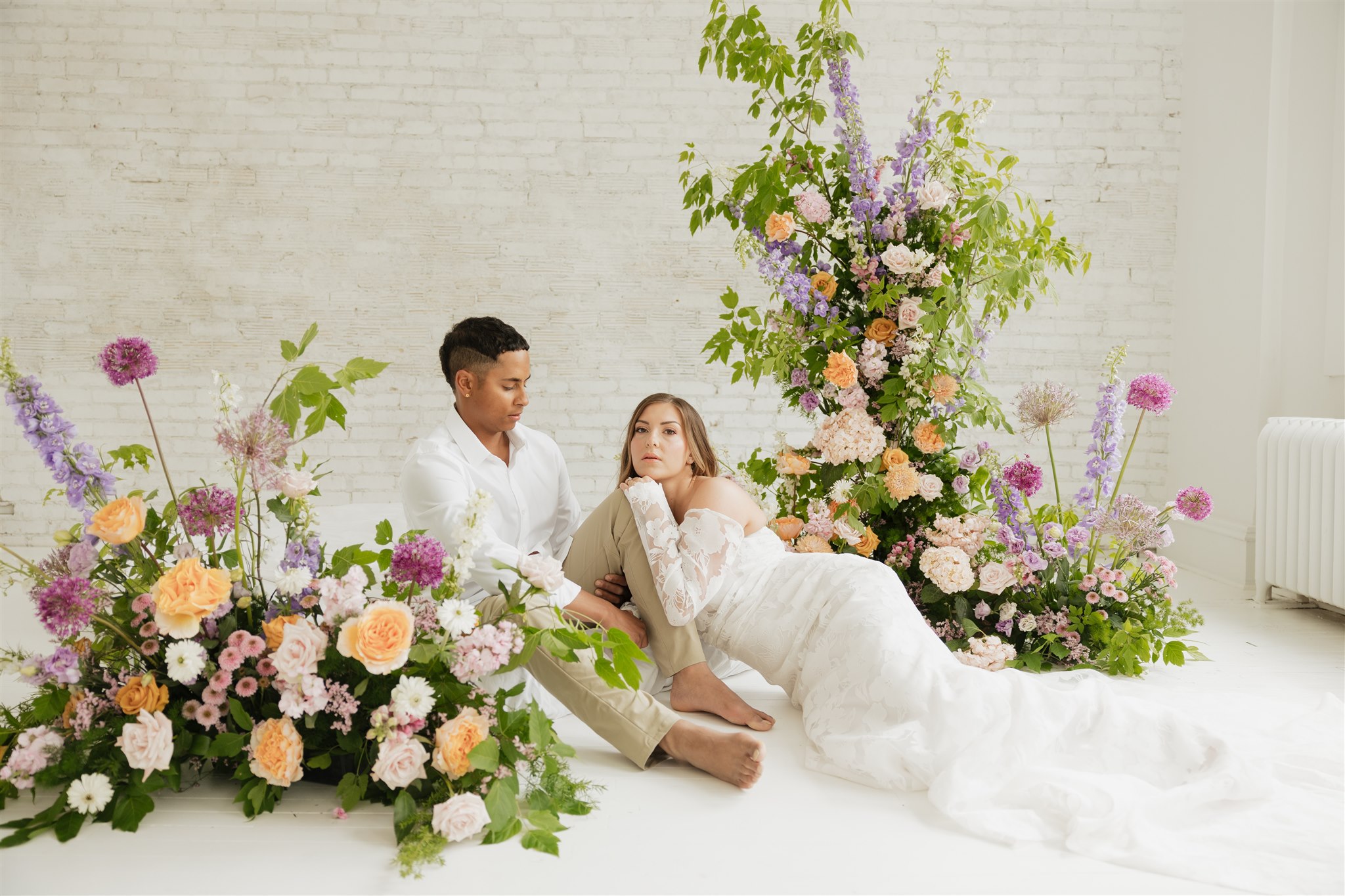 couple posing in a studio for their wedding portraits in canada - editorial wedding