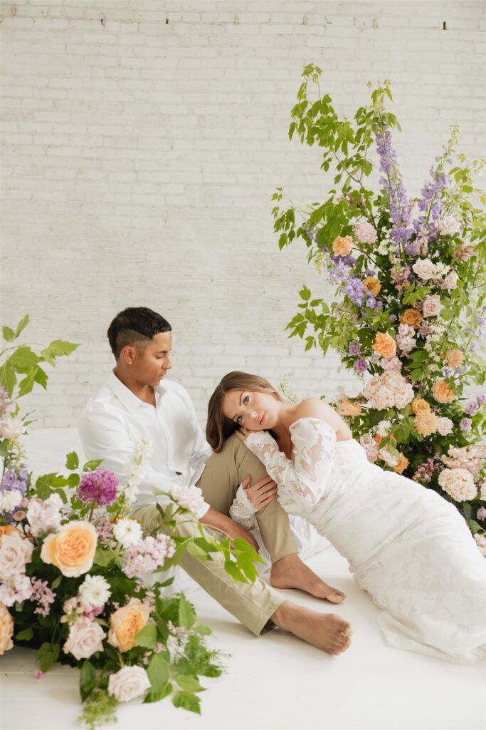 couple posing in a studio for their wedding portraits in canada - editorial wedding