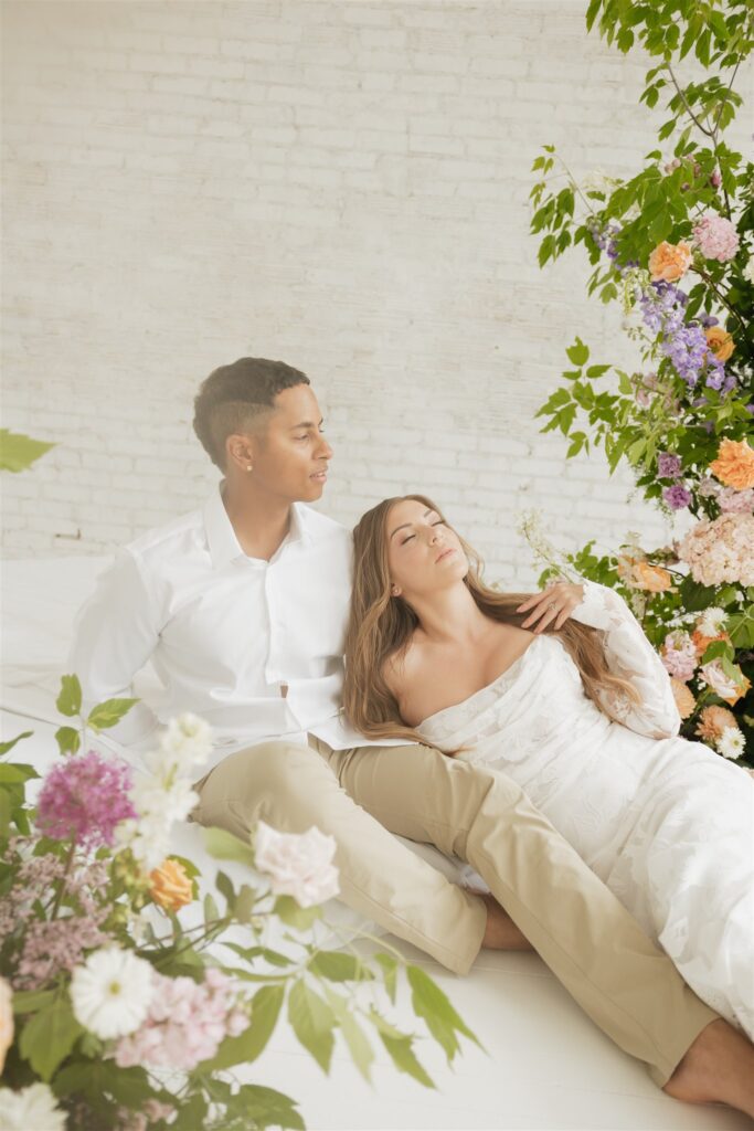 couple posing in a studio for their wedding portraits in canada - editorial wedding