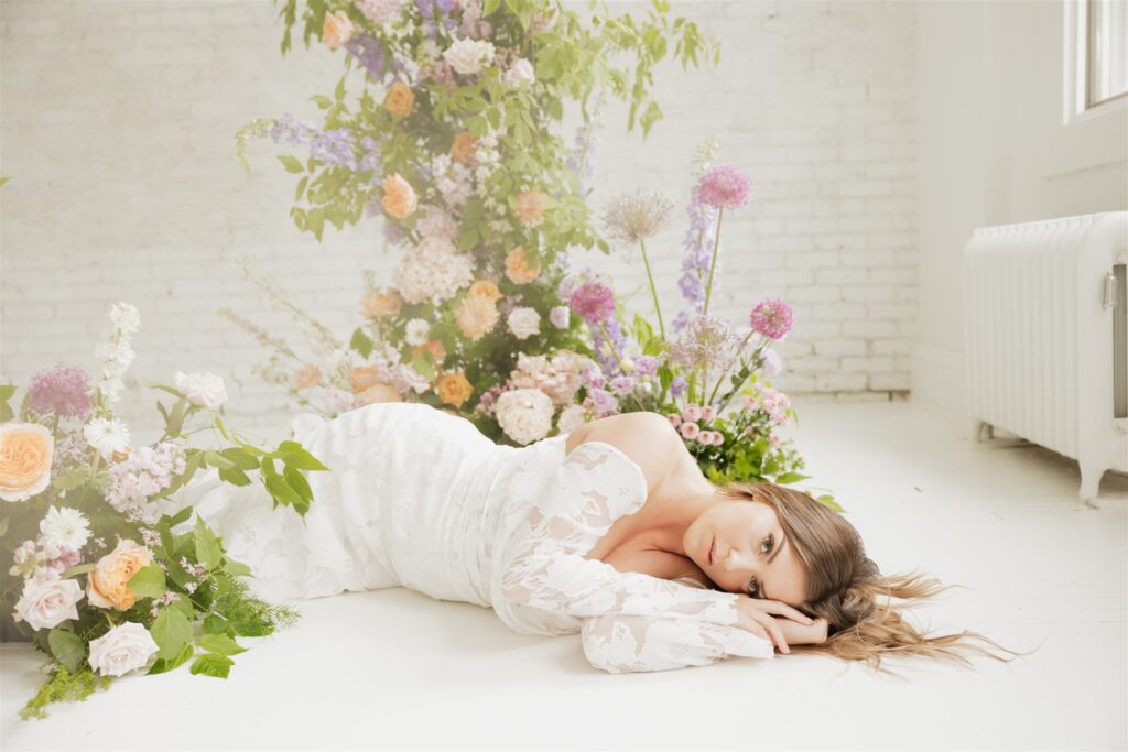 bride posing for her wedding portraits at a studio