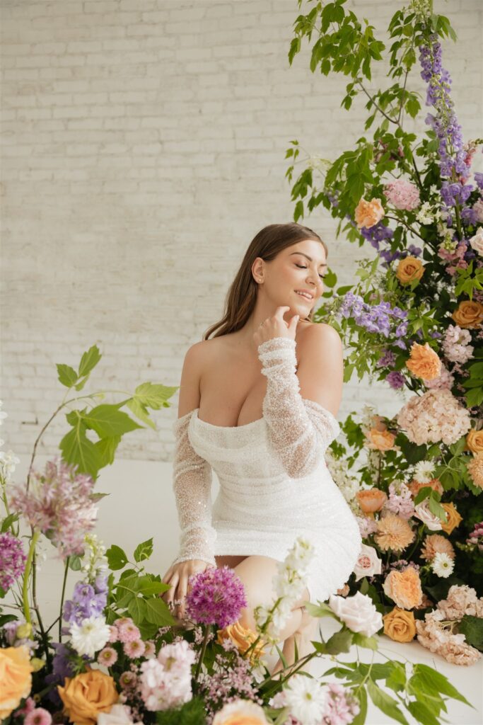 bride posing for her wedding portraits at a studio