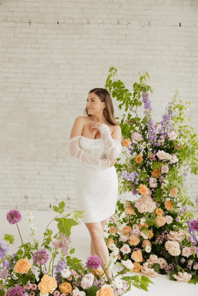 bride posing for her wedding portraits at a studio