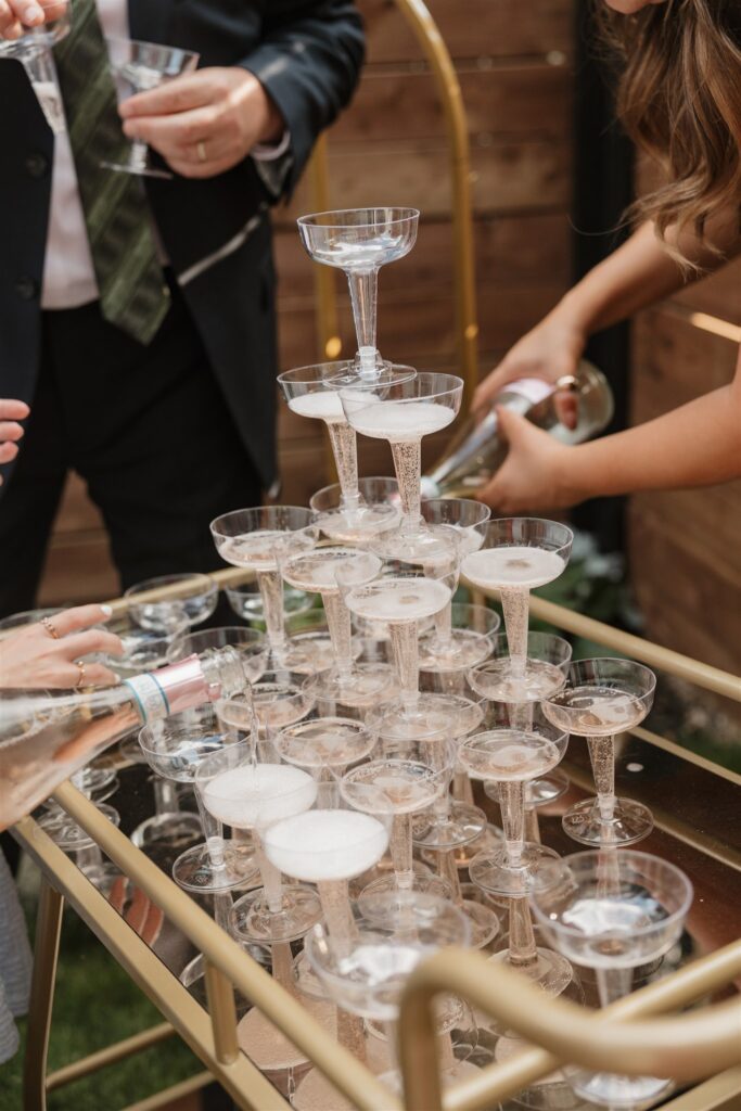 couple doing a champagne fountain bride and groom posing for their wedding portraits - wedding in moosejaw saskatchewan - ninth avenue studios
