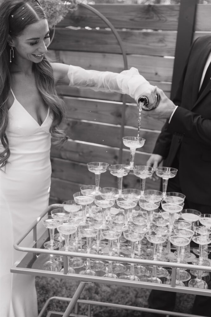 couple doing a champagne fountain