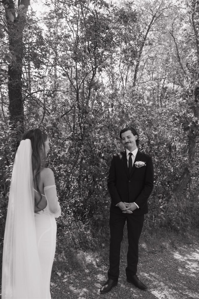 couple doing a first look and exchanging vows