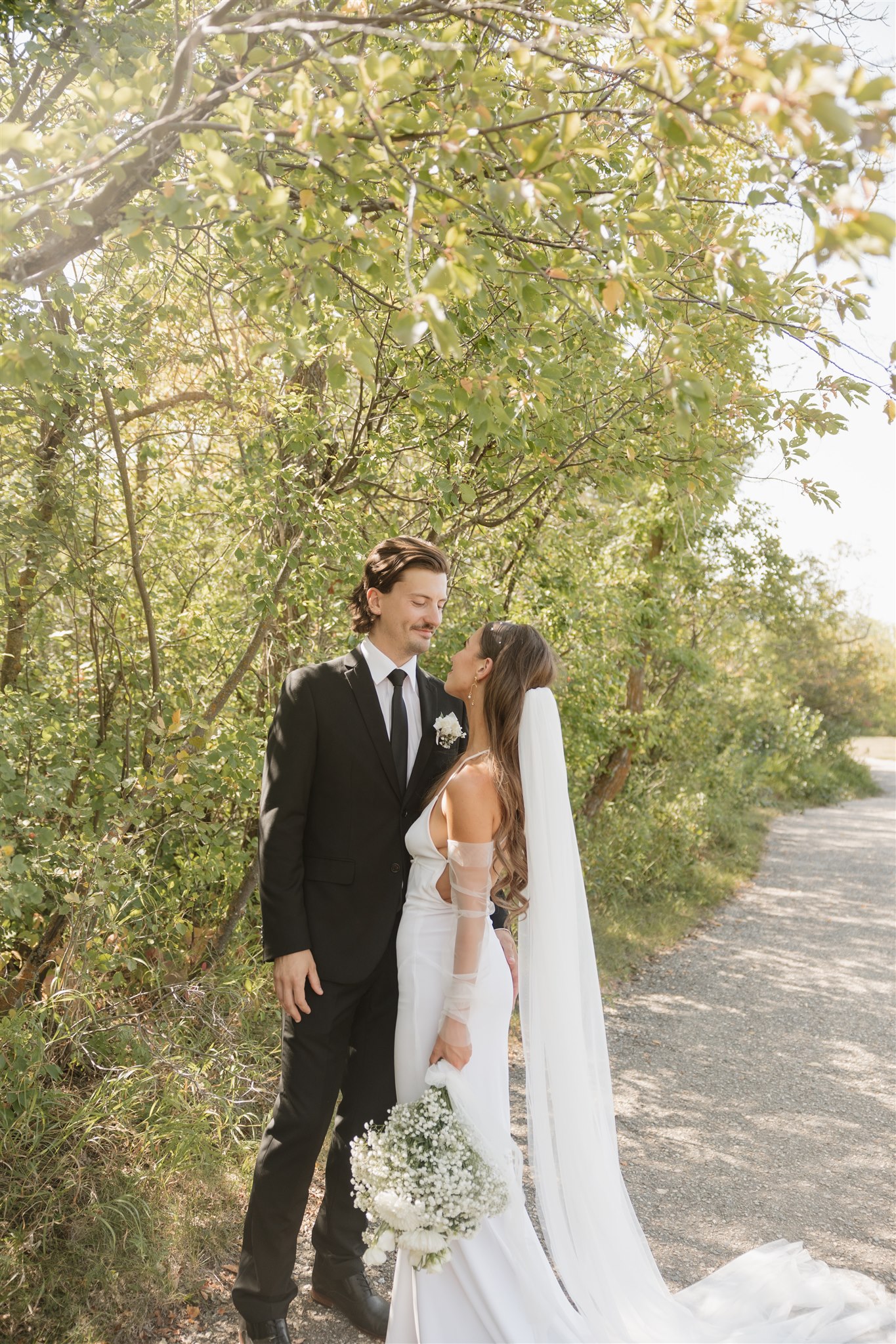 bride and groom posing for their wedding portraits - elegant modern wedding