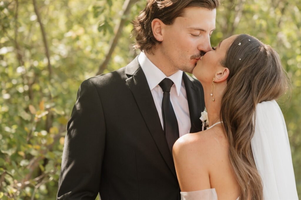 bride and groom posing for their wedding portraits - wedding in moosejaw saskatchewan - ninth avenue studios
