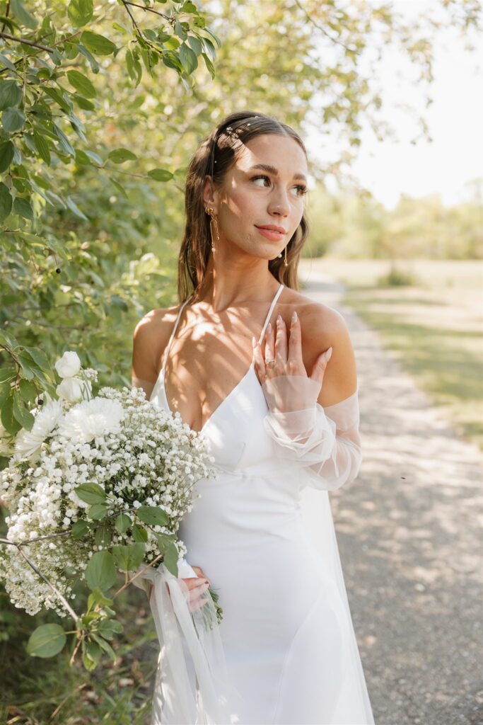 bride and groom posing for their wedding portraits - wedding in moosejaw saskatchewan - ninth avenue studios
