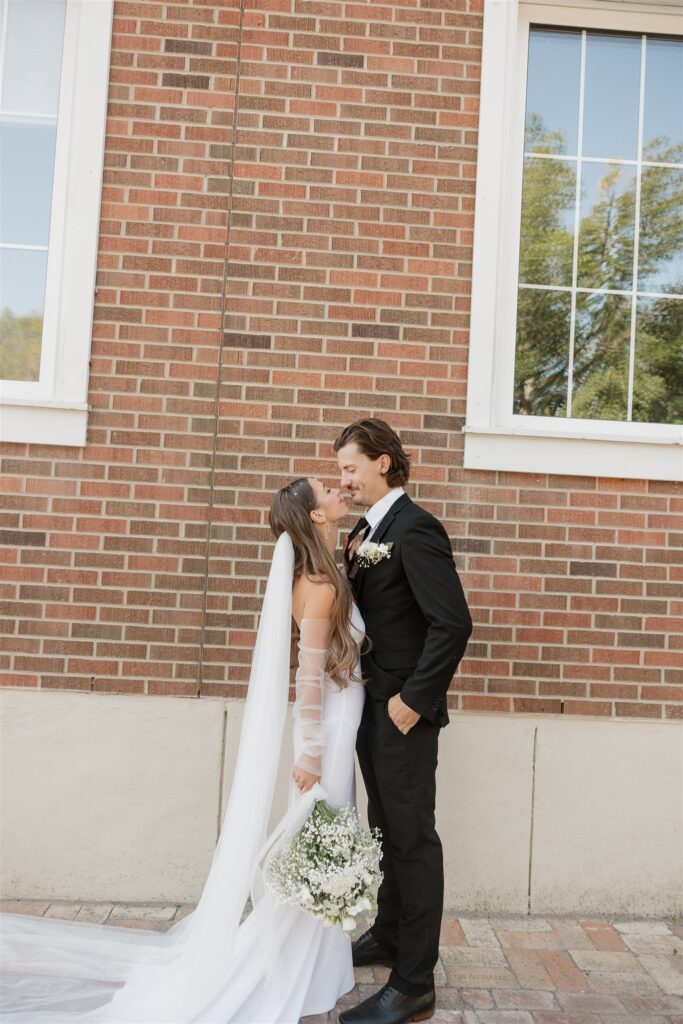 bride and groom posing for their wedding portraits - wedding in moosejaw saskatchewan - ninth avenue studios
