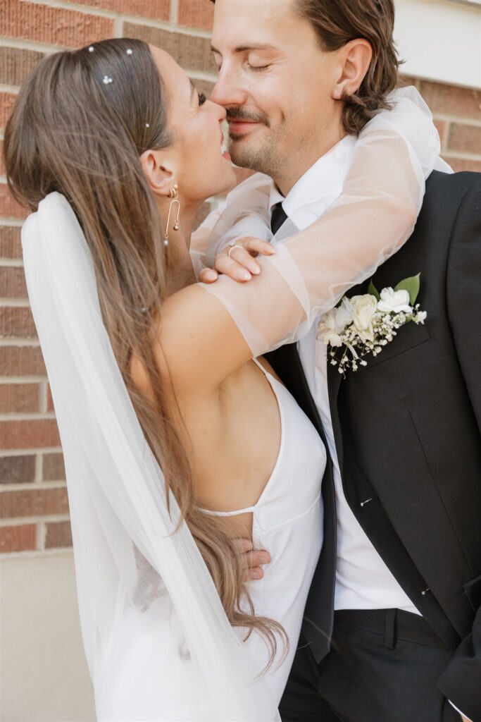 Couple posing for modern wedding photos in moose jaw, sk
