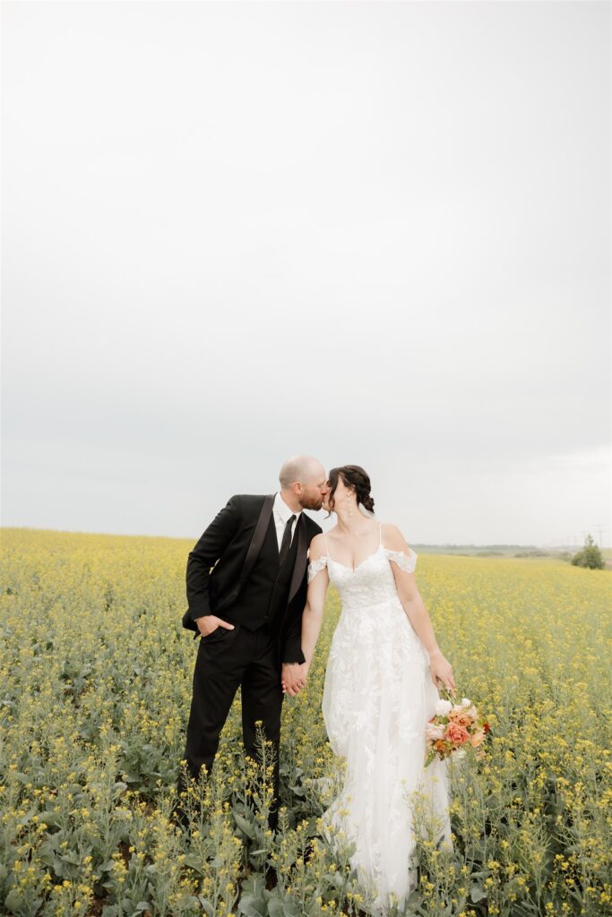 bride and groom posing in saskatoon for their wedding day photos