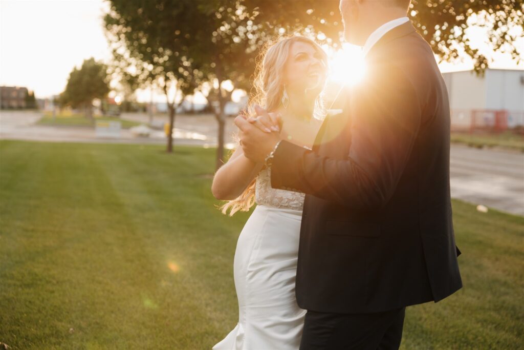 couple posing during golden hour for their wedding photos