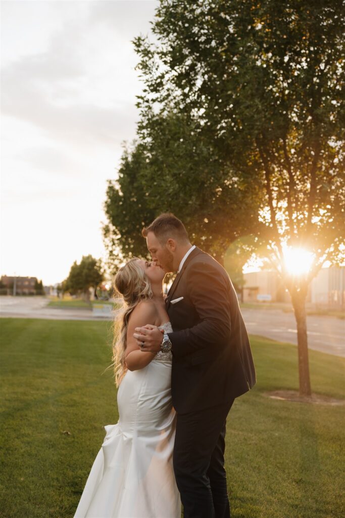 couple posing during golden hour for their wedding photos