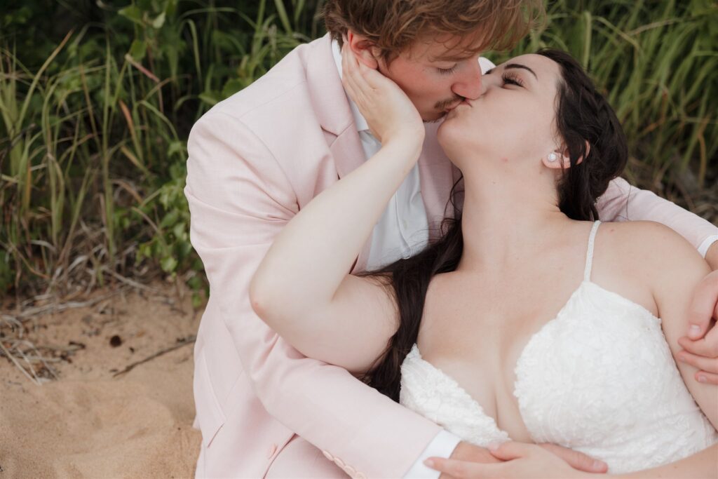 bride and groom posing for their wedding photos in a forest