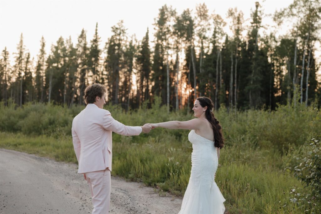 bride and groom posing outdoors for their wedding photos