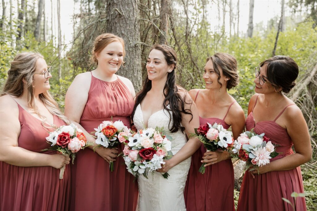 wedding party posing for wedding portrait photos Lac La Plonge in Saskatchewan outdoor wedding
