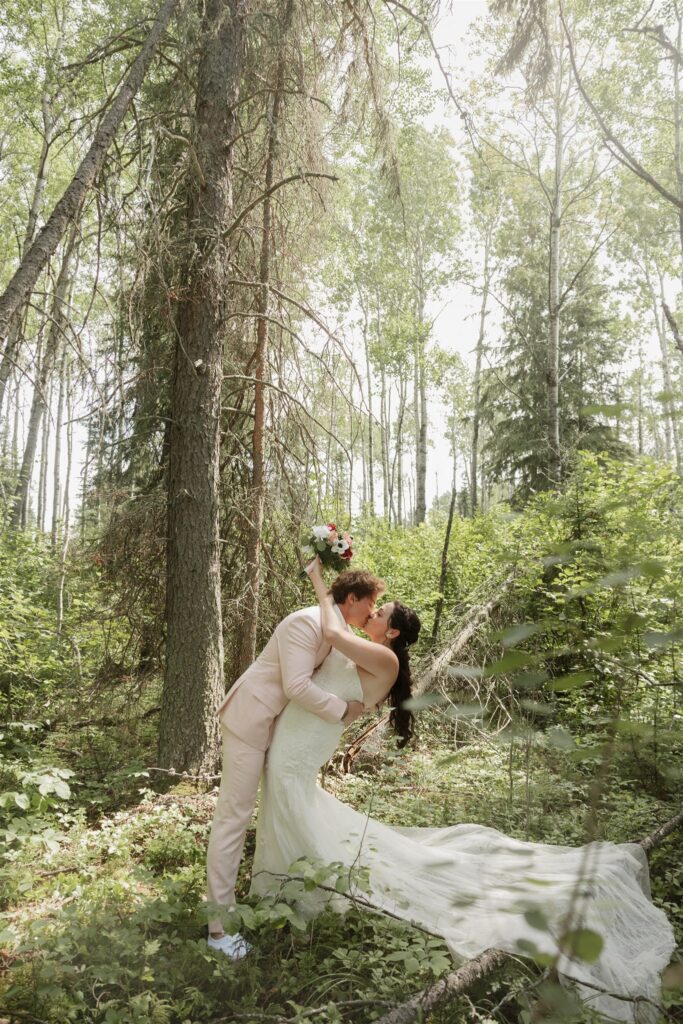 bride and groom posing outdoors for their wedding photos