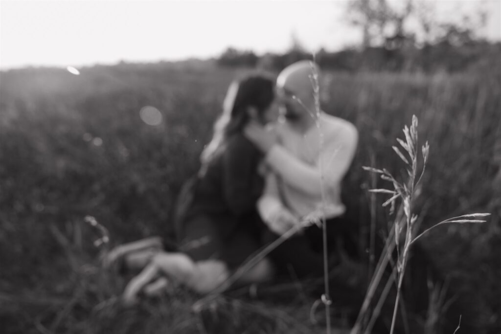 couple posing outdoors in saskatoon for a golden hour engagement session
