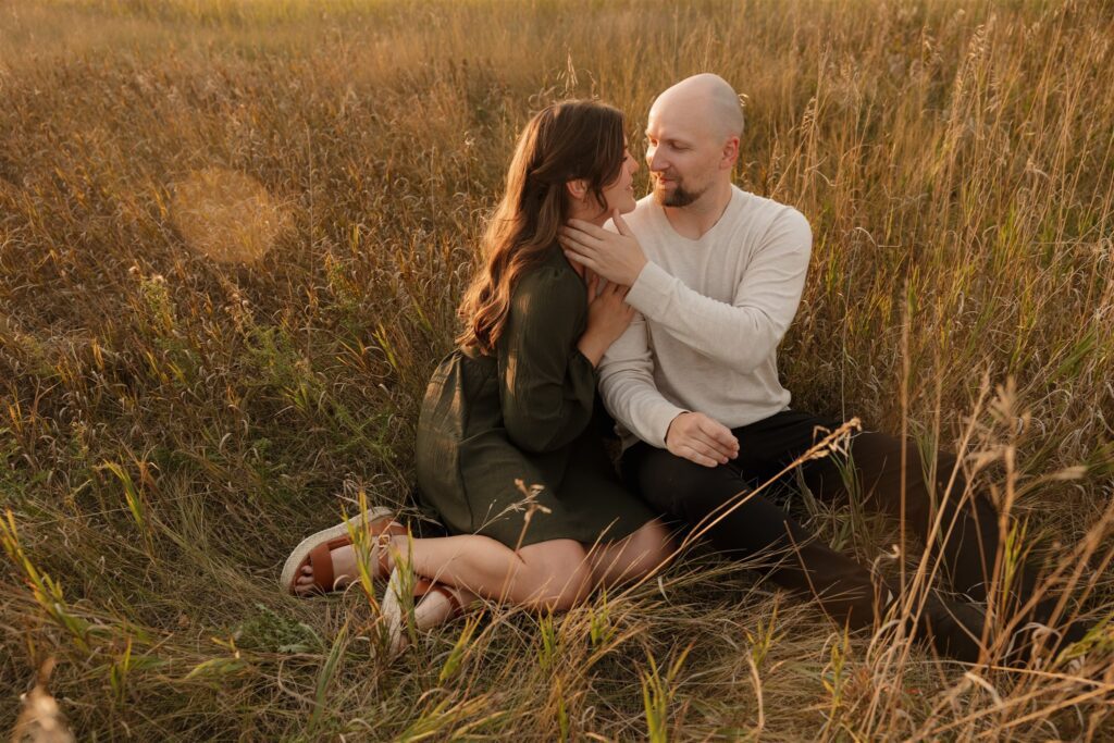 couple posing outdoors in saskatoon for a golden hour engagement session
